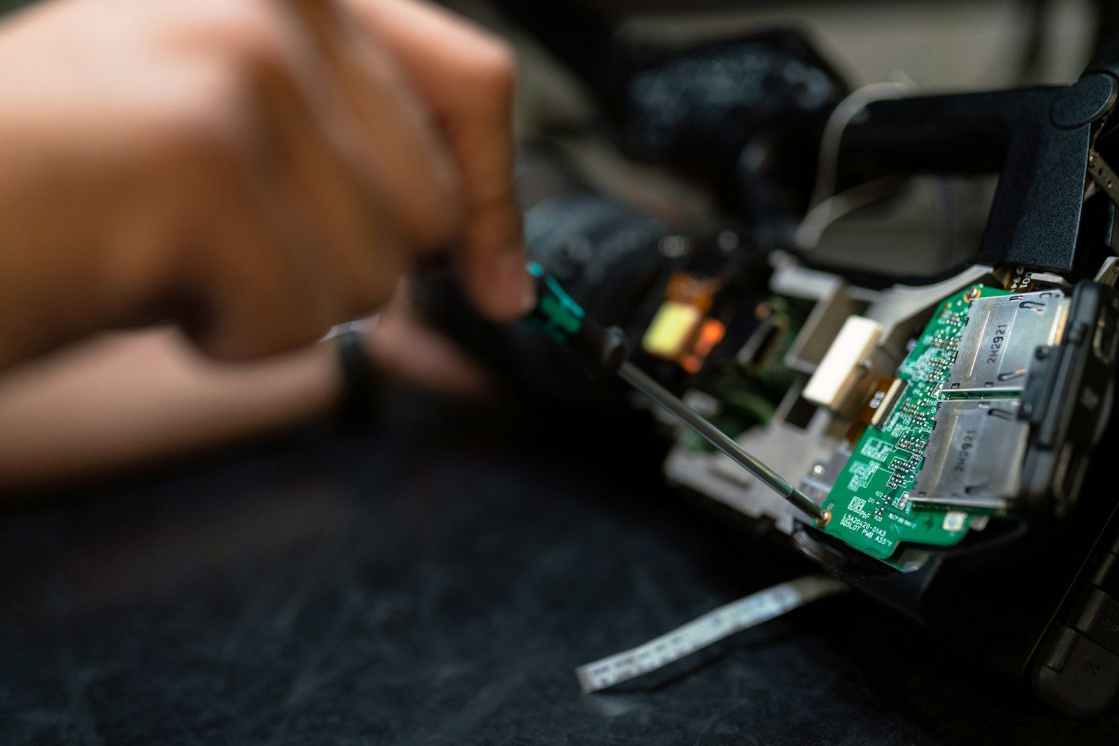 Technician working on an electronic circuit board